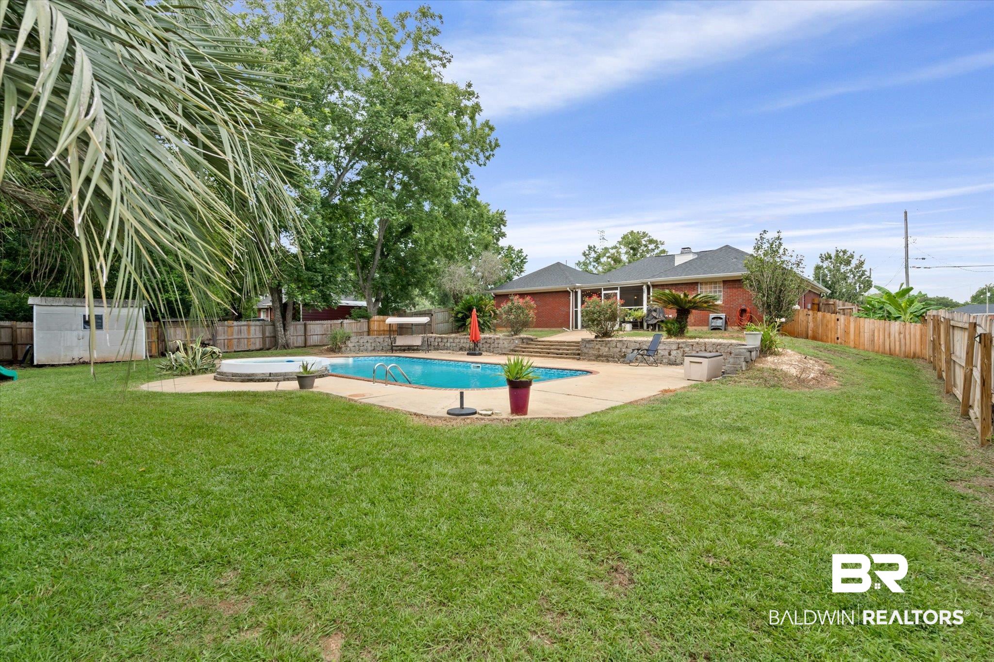 2320 Sequoya Trail Mobile, AL 36695 - Photo 17 of 20 View of swimming pool featuring a yard and a patio area