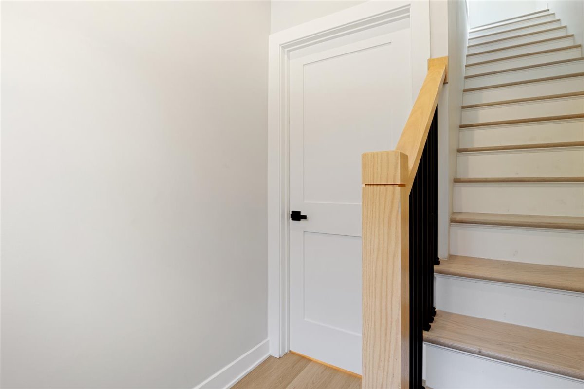 1110 West Addison Street Chicago, IL 60613 - Photo 25 of 49 a view of staircase with white walls and white door