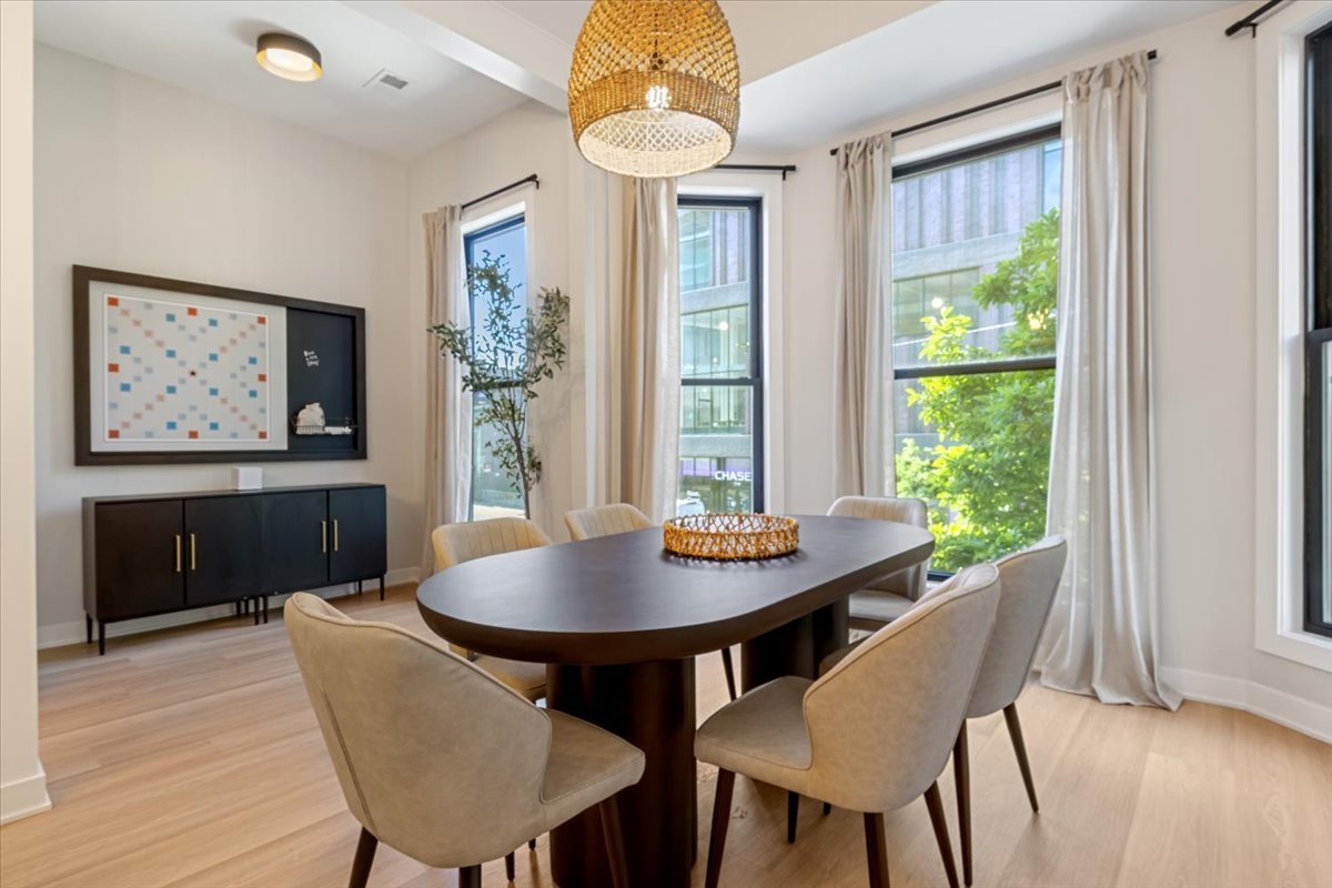 1110 West Addison Street Chicago, IL 60613 - Photo 27 of 49 a view of a dining room with furniture window and wooden floor