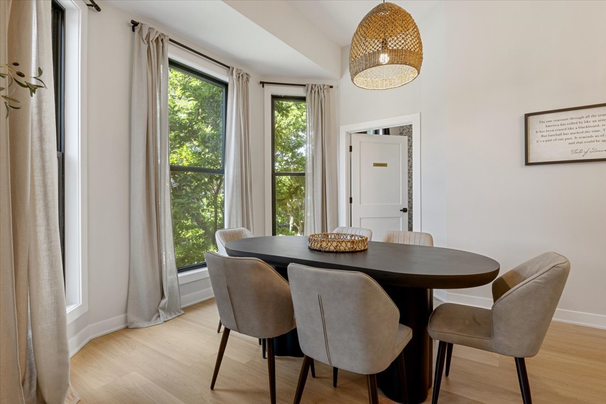 1110 West Addison Street Chicago, IL 60613 - Photo 28 of 49 a view of a dining room with furniture window and wooden floor