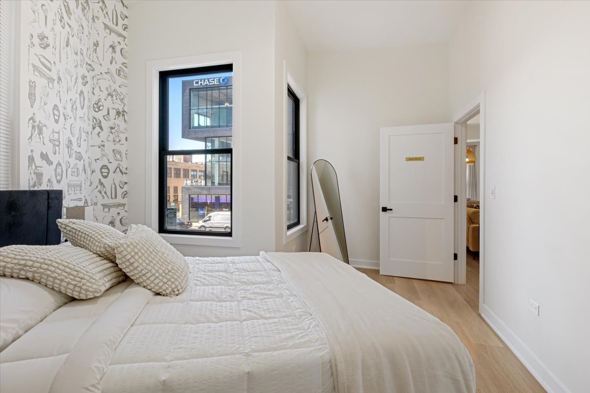 1110 West Addison Street Chicago, IL 60613 - Photo 35 of 49 a bedroom with a bed next to a window