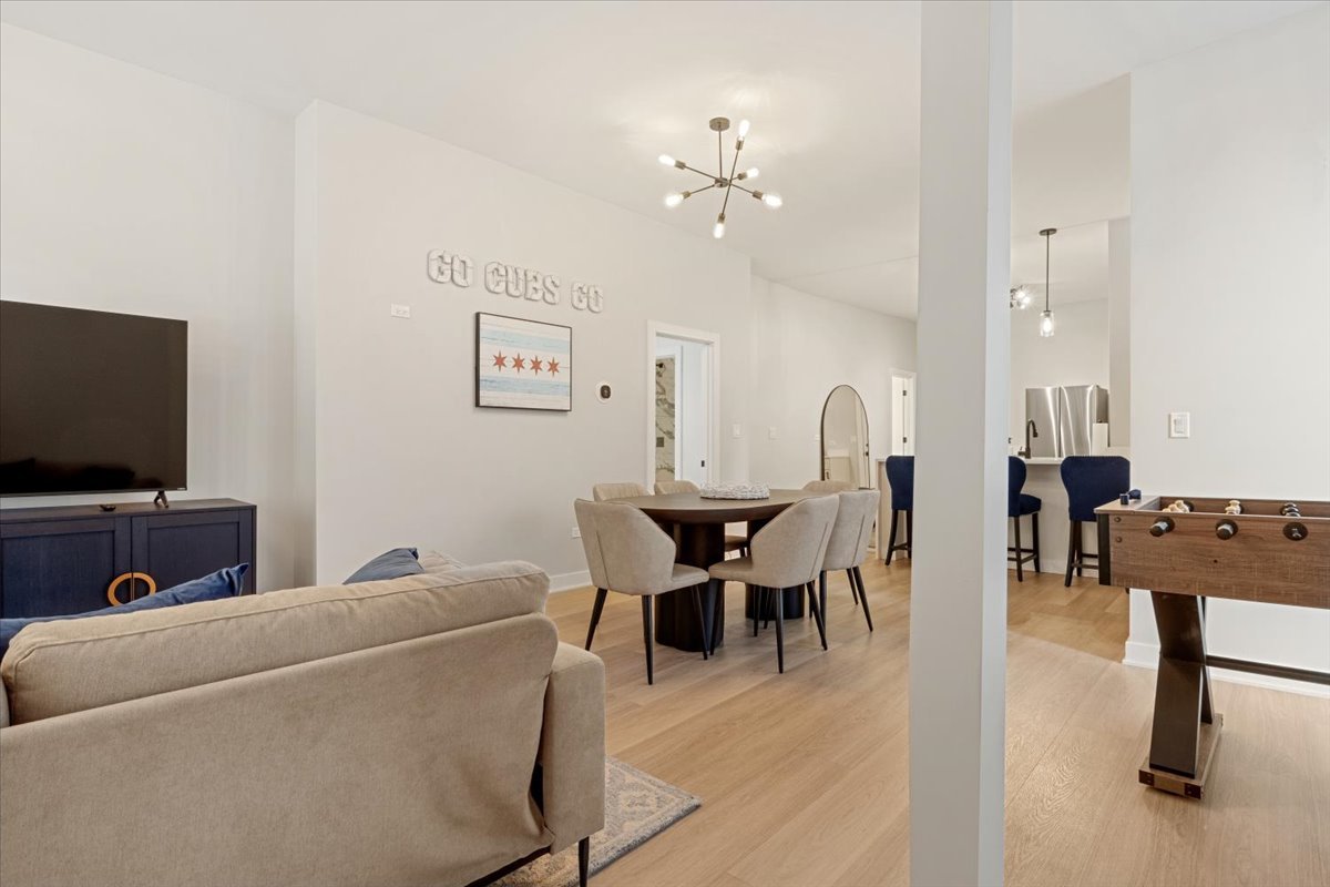 1110 West Addison Street Chicago, IL 60613 - Photo 5 of 49 a view of a livingroom with furniture and a flat screen tv