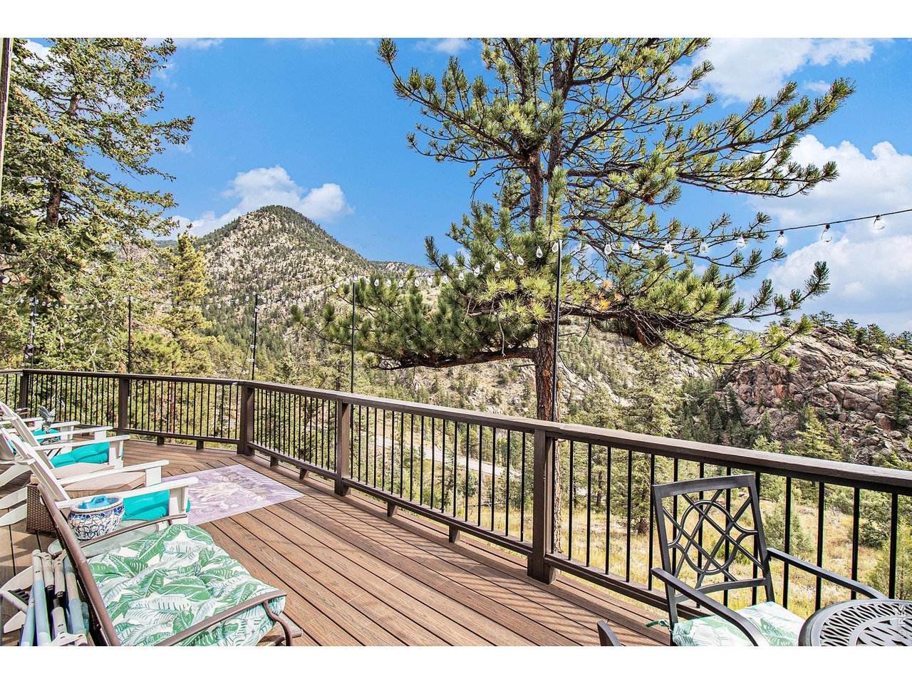 270 Choctaw Road Lyons, CO 80540 - Photo 2 of 32 Expansive deck overlooking the surrounding mountains and pines