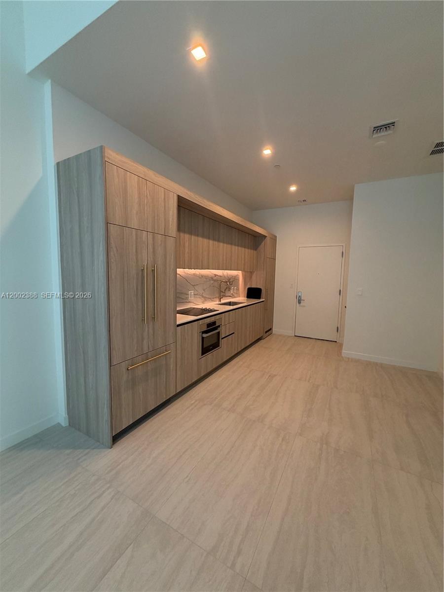 77 Southeast 5th Street, Unit 1208 Miami, FL 33131 - Photo 2 of 32 a view of an empty room