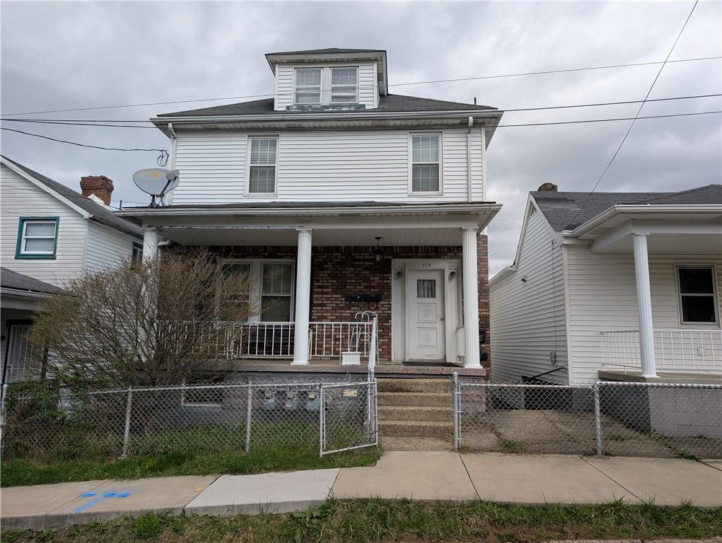 619 Conrad Avenue, Unit 2 Charleroi, PA 15022 - Photo 1 of 8 a house that has a lot of windows on it