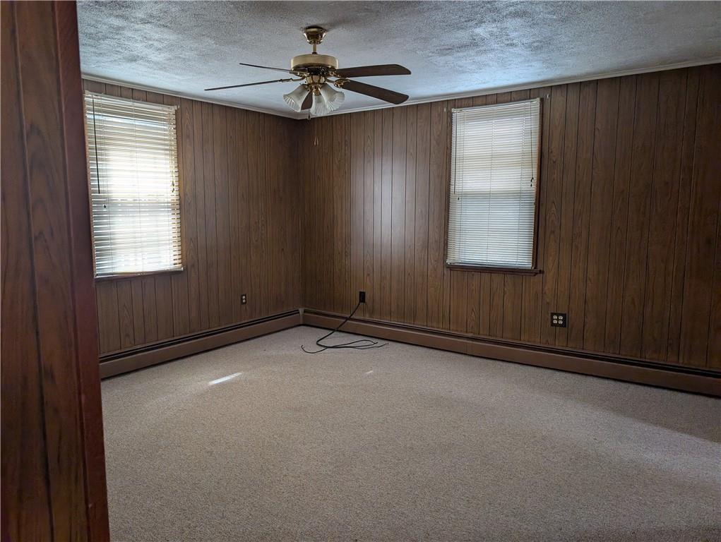 619 Conrad Avenue, Unit 2 Charleroi, PA 15022 - Photo 4 of 8 an empty room with windows and fan