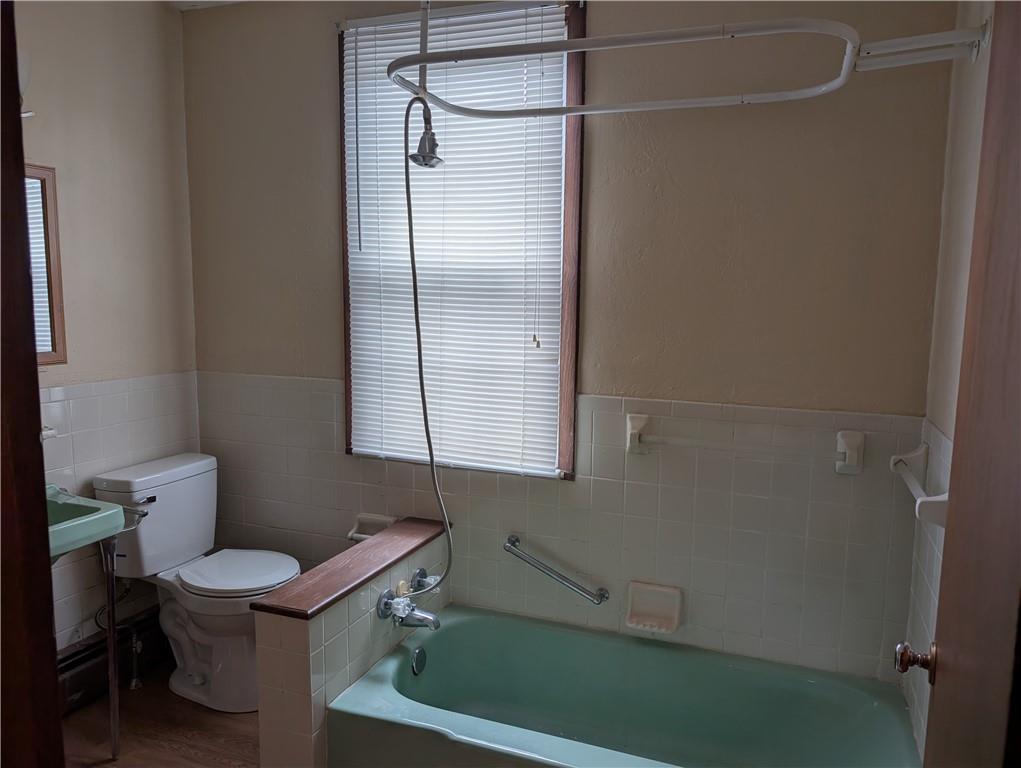 619 Conrad Avenue, Unit 2 Charleroi, PA 15022 - Photo 6 of 8 a bathroom with a toilet and a shower