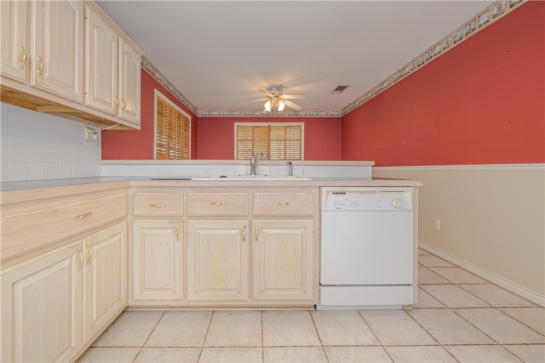10416 7th Street Pettus, TX 78146 - Photo 13 of 40 a kitchen with white cabinets