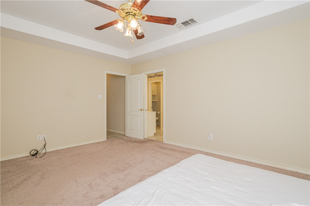 10416 7th Street Pettus, TX 78146 - Photo 16 of 40 a view of an empty room with a fan