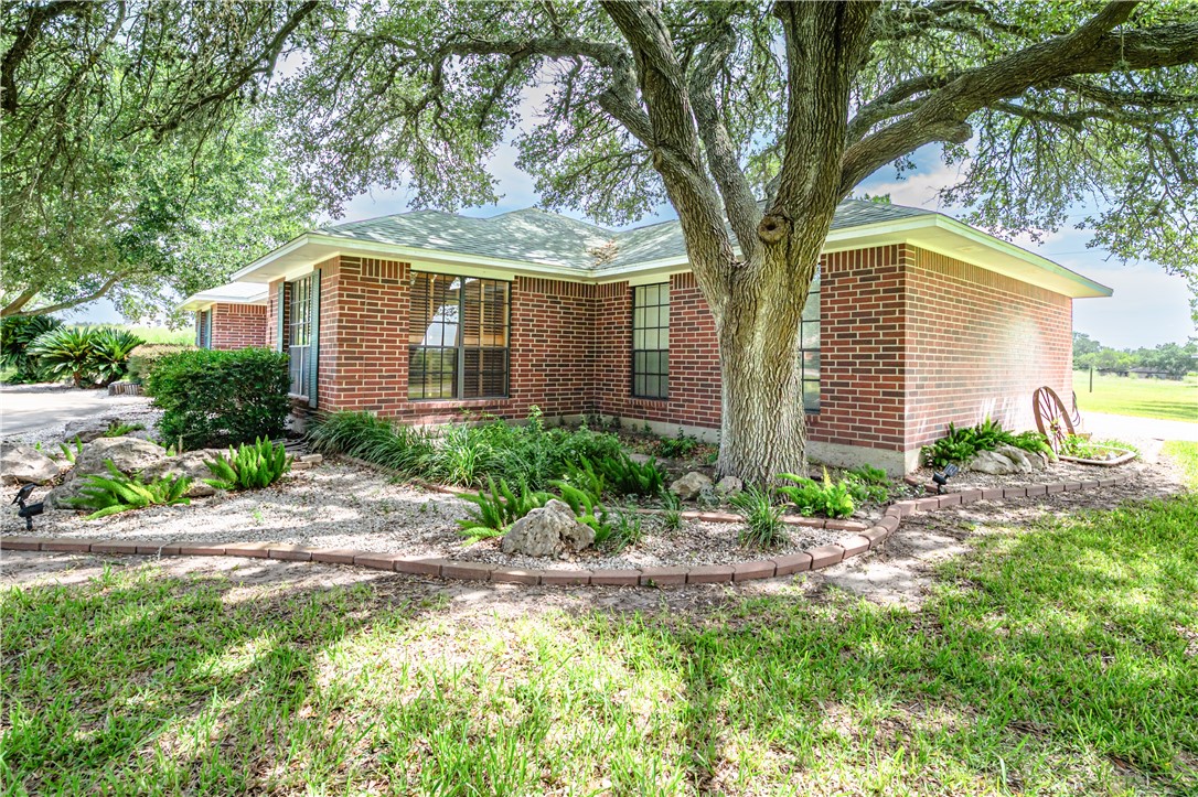 10416 7th Street Pettus, TX 78146 - Photo 2 of 40 a front view of house with yard and trees around