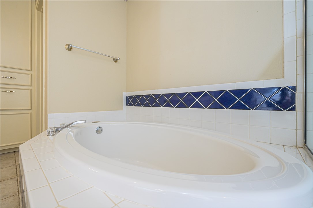 10416 7th Street Pettus, TX 78146 - Photo 21 of 40 a bathroom with a bathtub and a shower