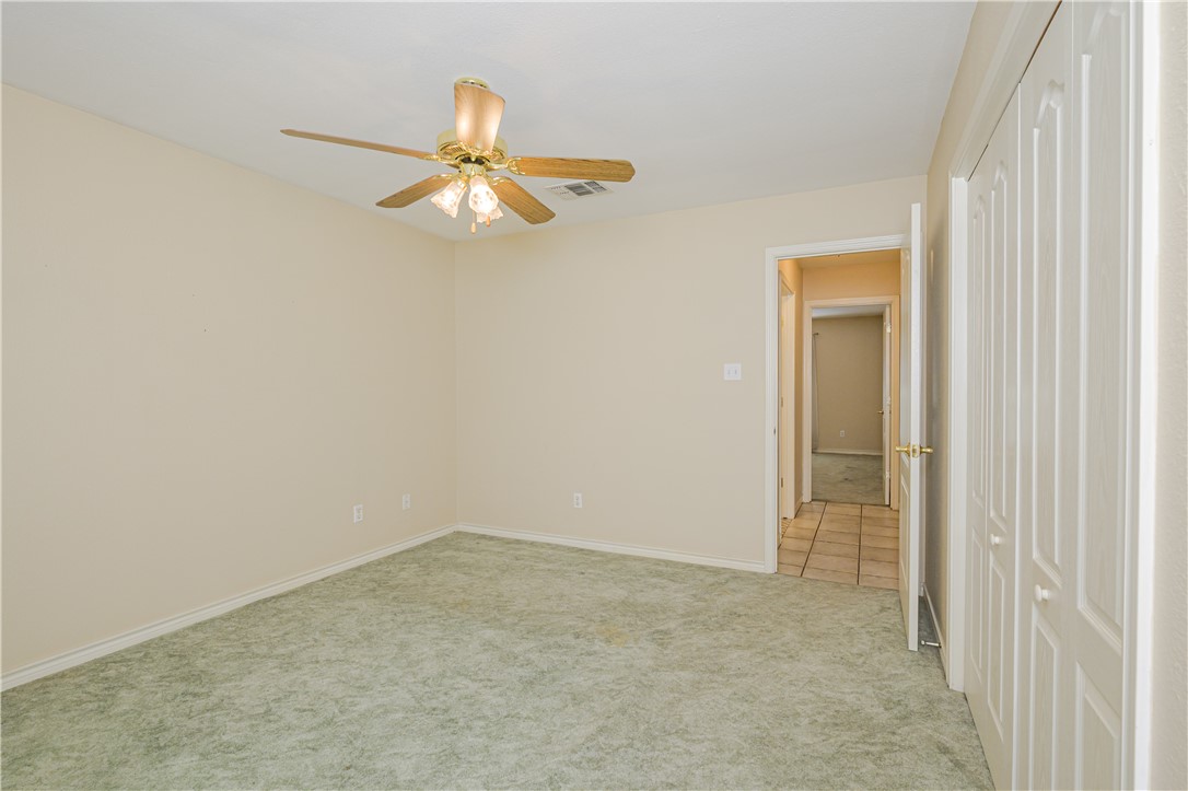 10416 7th Street Pettus, TX 78146 - Photo 23 of 40 an empty room with windows and fan