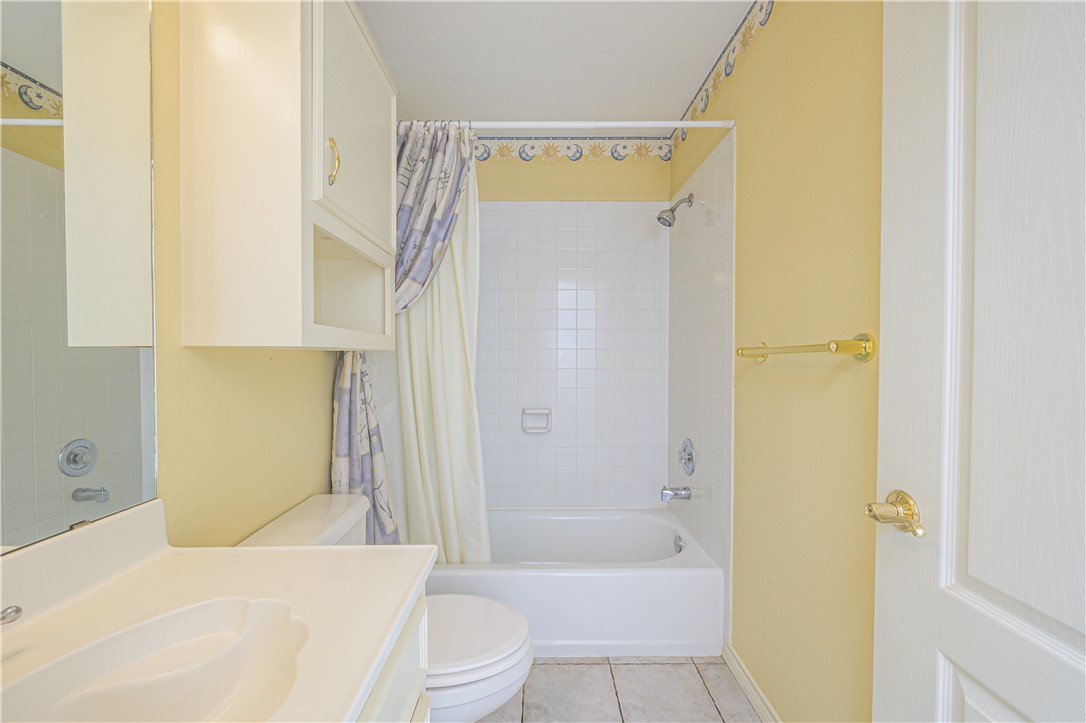 10416 7th Street Pettus, TX 78146 - Photo 25 of 40 a bathroom with a bathtub shower sink vanity and toilet