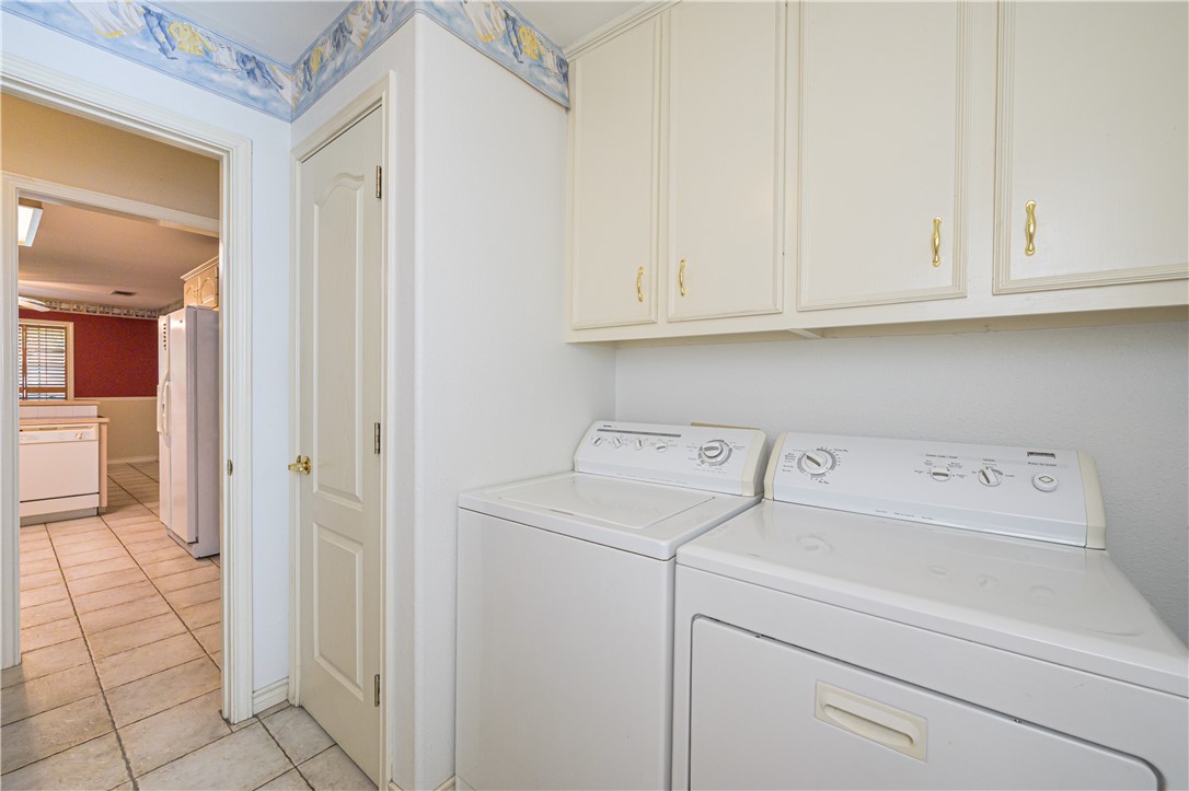 10416 7th Street Pettus, TX 78146 - Photo 30 of 40 a view of storage and utility room with washer and dryer