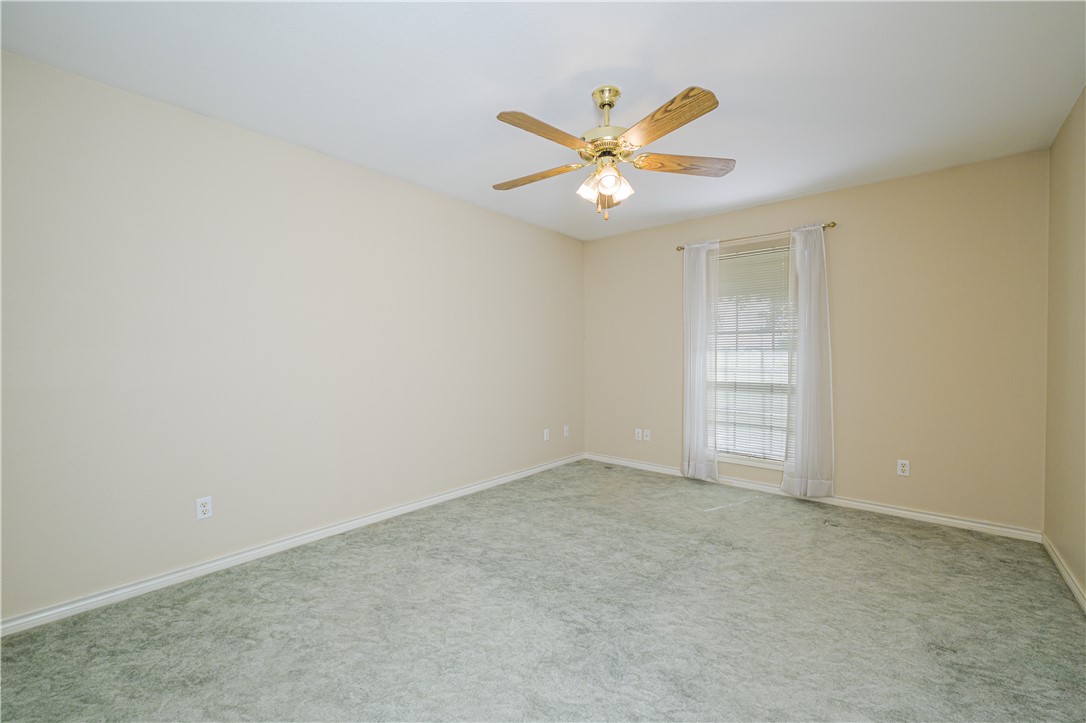 10416 7th Street Pettus, TX 78146 - Photo 32 of 40 an empty room with windows and fan