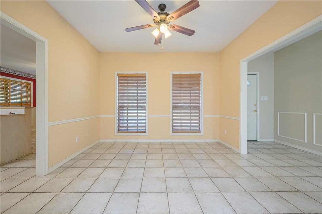 10416 7th Street Pettus, TX 78146 - Photo 6 of 40 a view of an empty room with window and chandelier fan