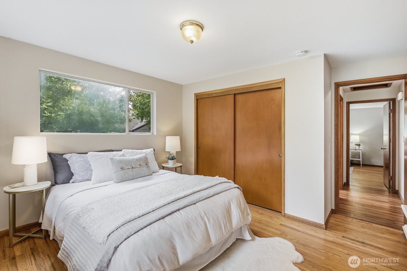 3822 Shelby Road Lynnwood, WA 98087 - Photo 19 of 40 a bedroom with a bed and a large window
