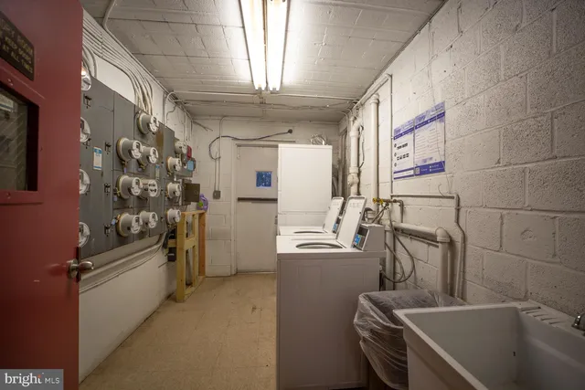 a view of a storage & utility room with racks a window