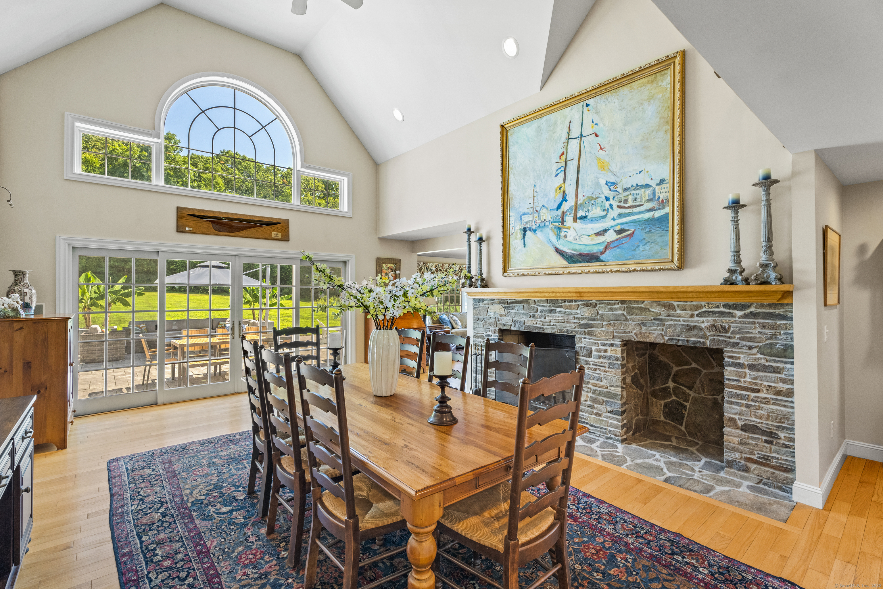 57 Northwest Corner Road Preston, CT 06365 - Photo 11 of 40 a dining room with furniture a fireplace and a floor to ceiling window