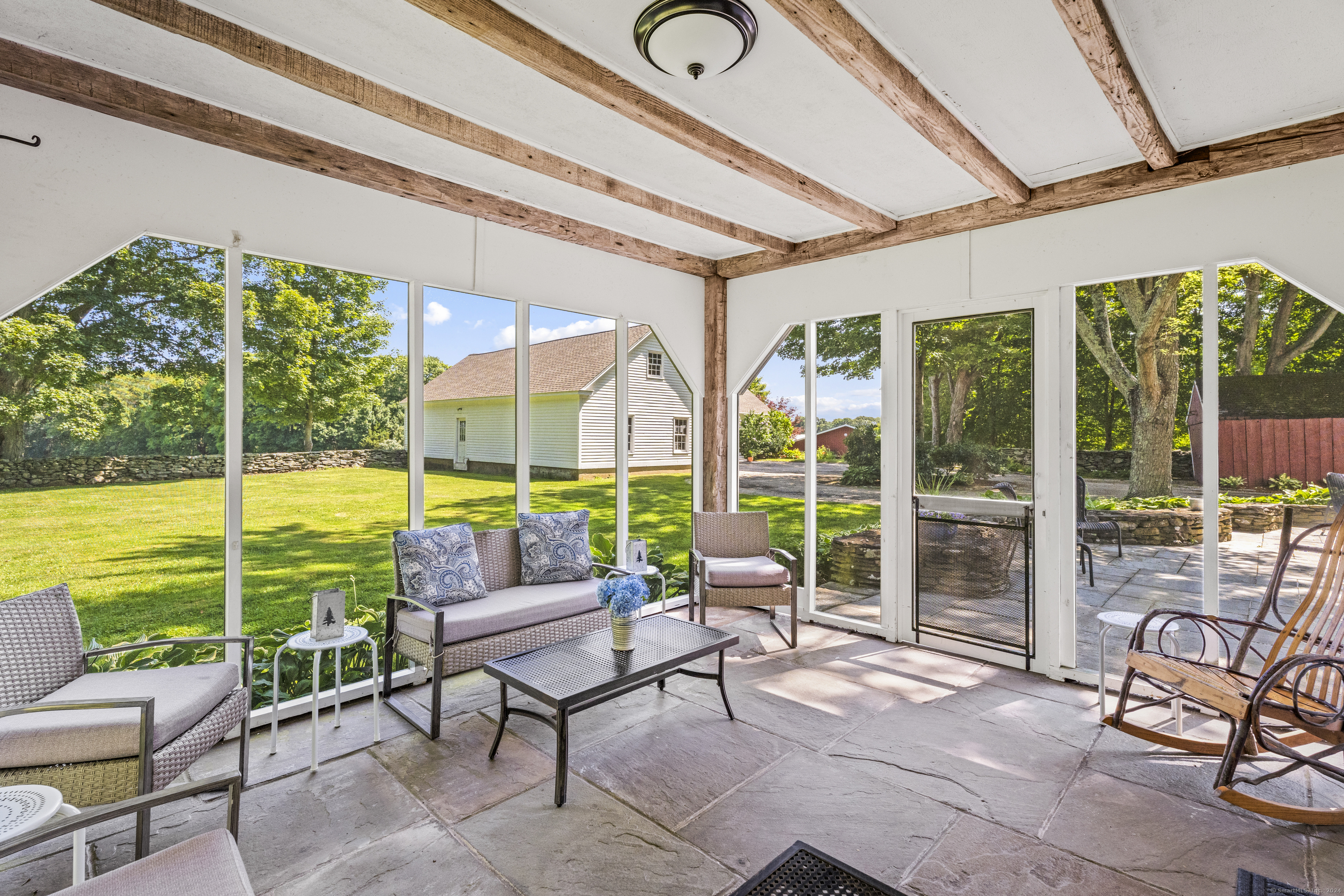 57 Northwest Corner Road Preston, CT 06365 - Photo 20 of 40 a living room with furniture and floor to ceiling windows