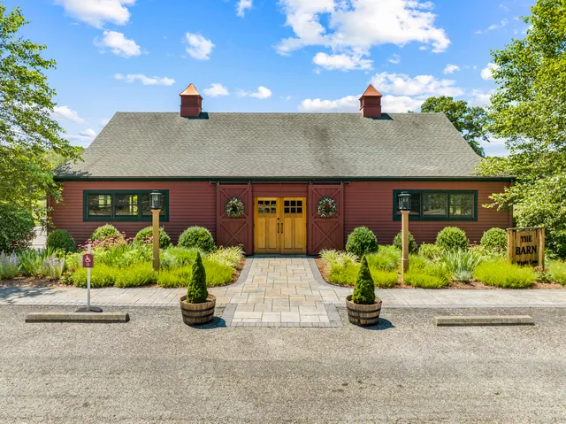 a view of a house with garden and pathway