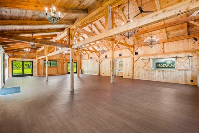 a view of a room with wooden floors