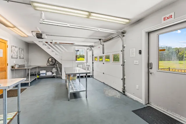 a garage with table and chairs