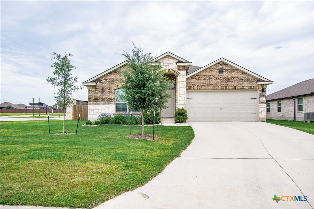 5824 Copano Road Belton, TX 76513 - Photo 1 of 1 a front view of house with a garden