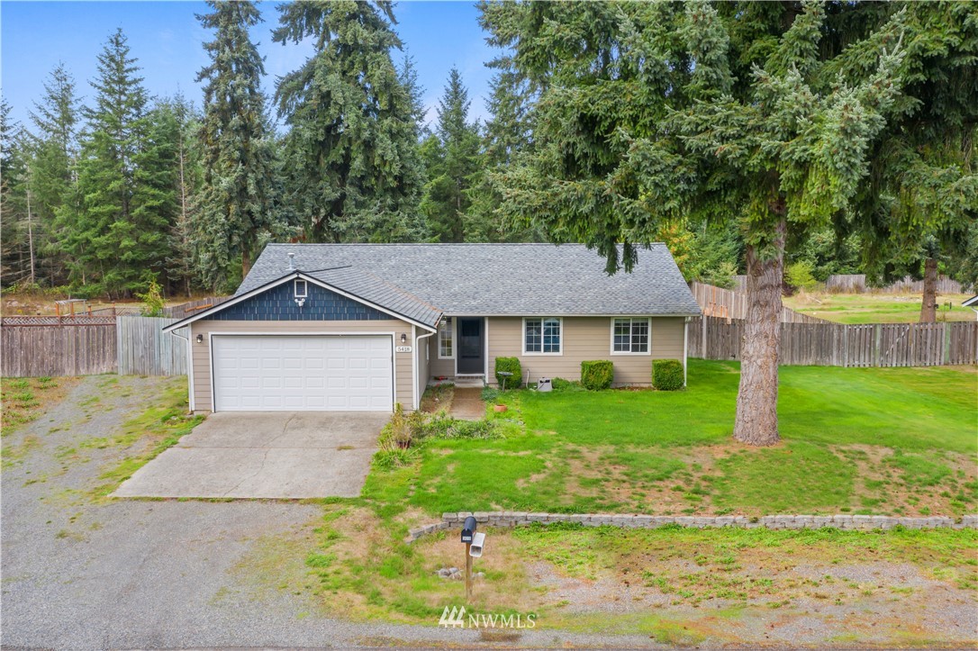5418 187th Court Southwest Rochester, WA 98579 - Photo 1 of 24 a front view of a house with a yard