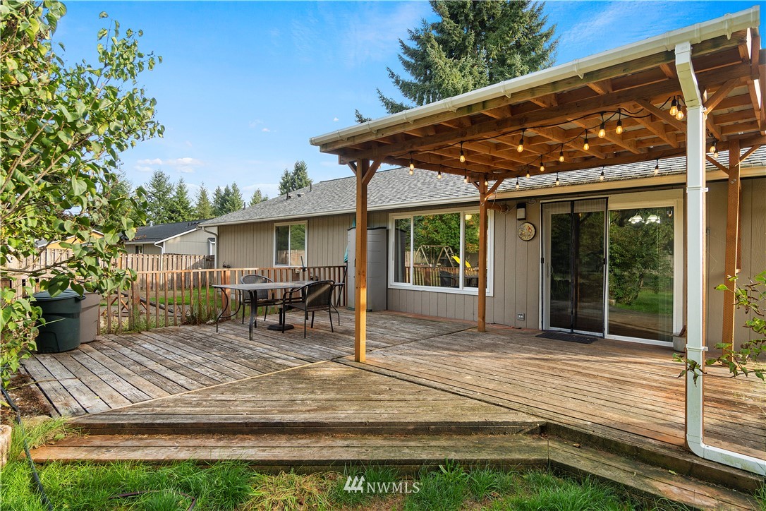 5418 187th Court Southwest Rochester, WA 98579 - Photo 18 of 24 a view of house with backyard