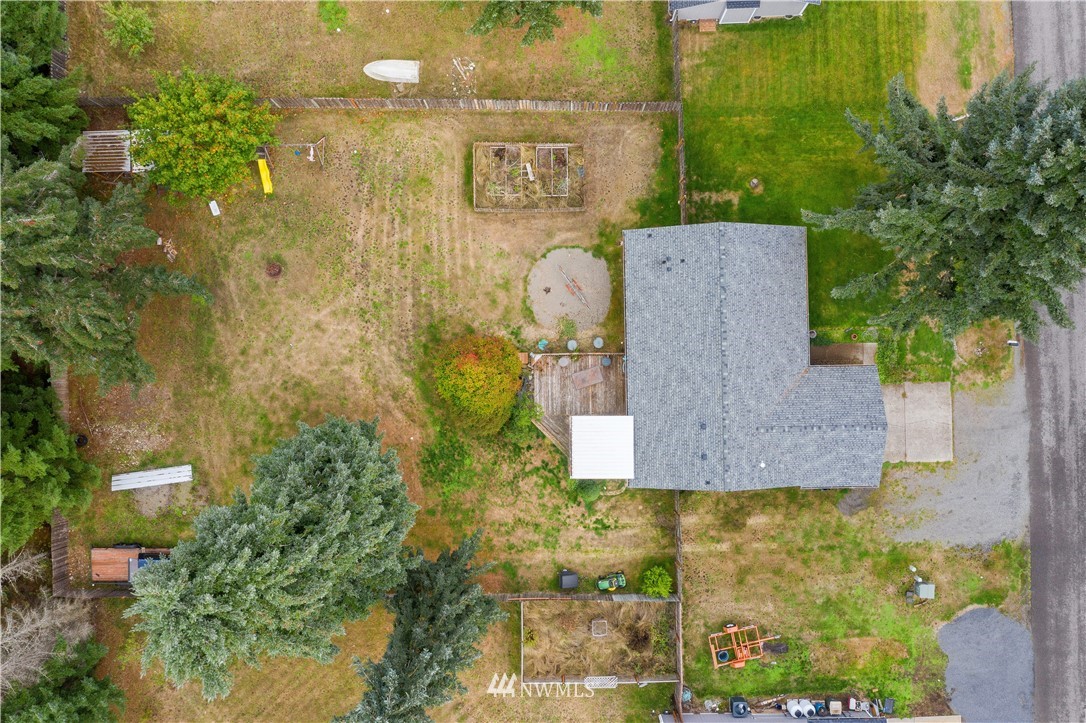 5418 187th Court Southwest Rochester, WA 98579 - Photo 21 of 24 an aerial view of a house with a yard
