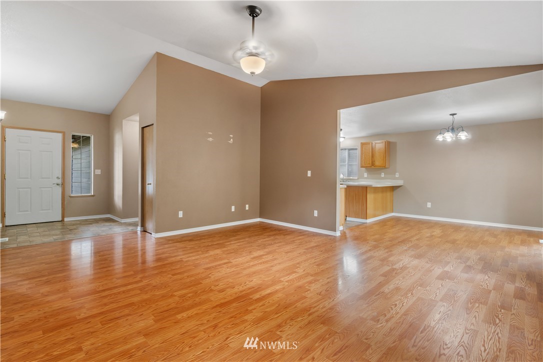 5418 187th Court Southwest Rochester, WA 98579 - Photo 4 of 24 a view of an empty room and kitchen view