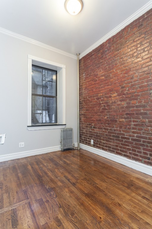20 Prince Street, Unit 2 Manhattan, NY 10012 - Photo 3 of 3 a view of an empty room with wooden floor and a window