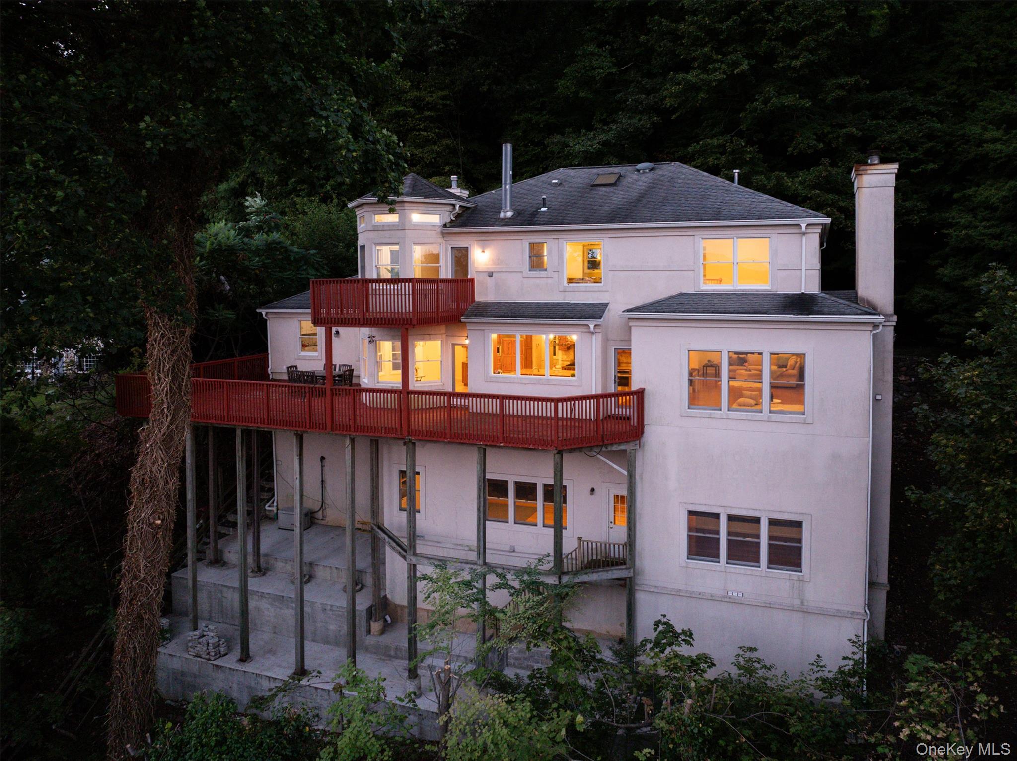 921 Rte 9W Nyack, NY 10960 - Photo 1 of 1 a front view of a house with balcony and trees around
