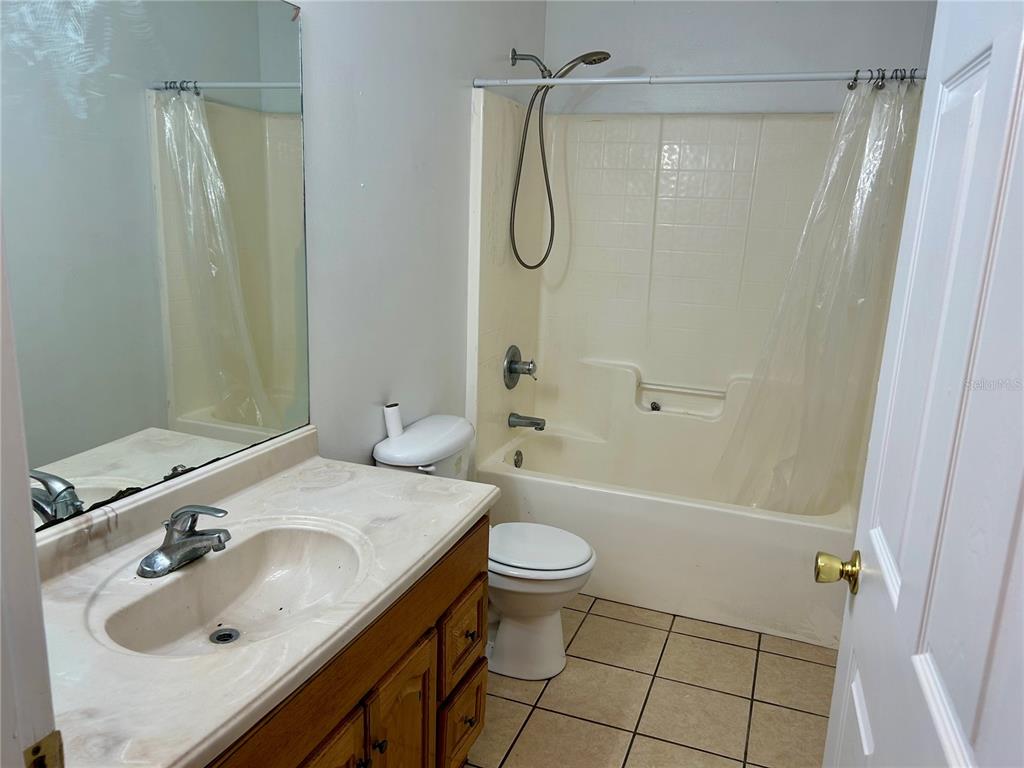 209 1st Avenue Wauchula, FL 33873 - Photo 17 of 27 a bathroom with a sink toilet and shower