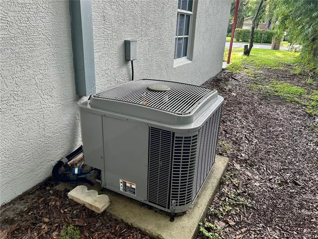 a backyard of a house with yard and outdoor seating