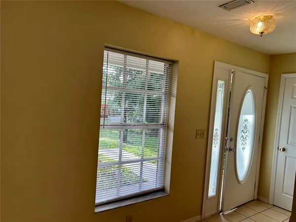 a view of front door with wooden floor