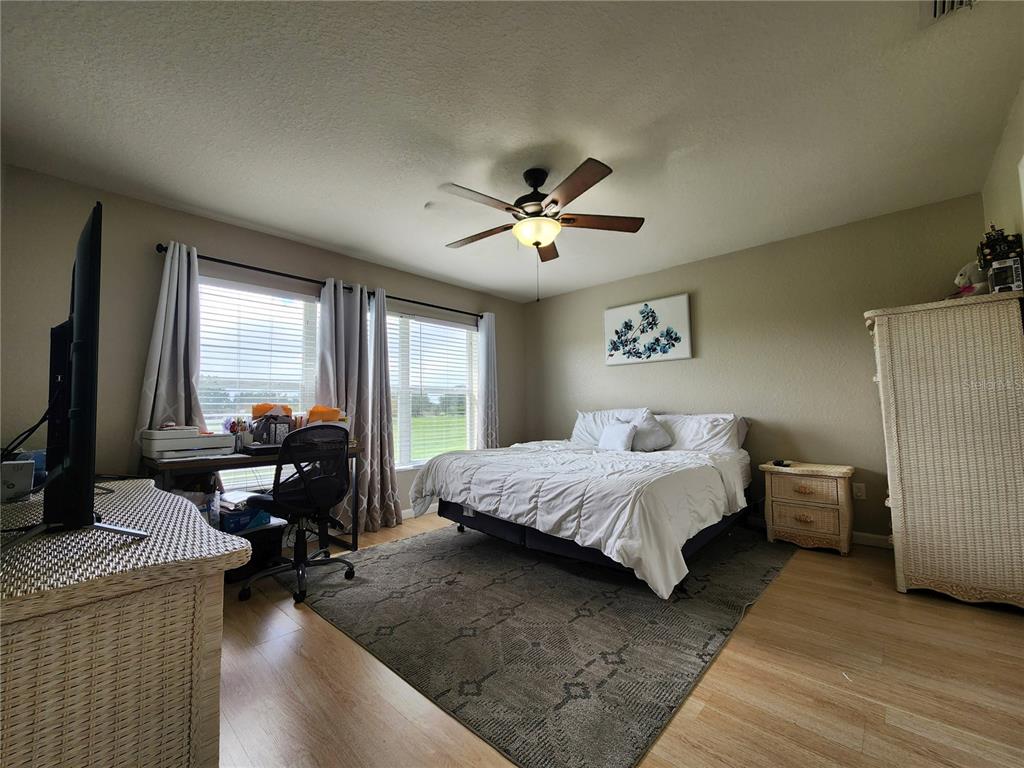 4740 Southwest 41st Street Ocala, FL 34474 - Photo 20 of 31 a bed room with bed and window