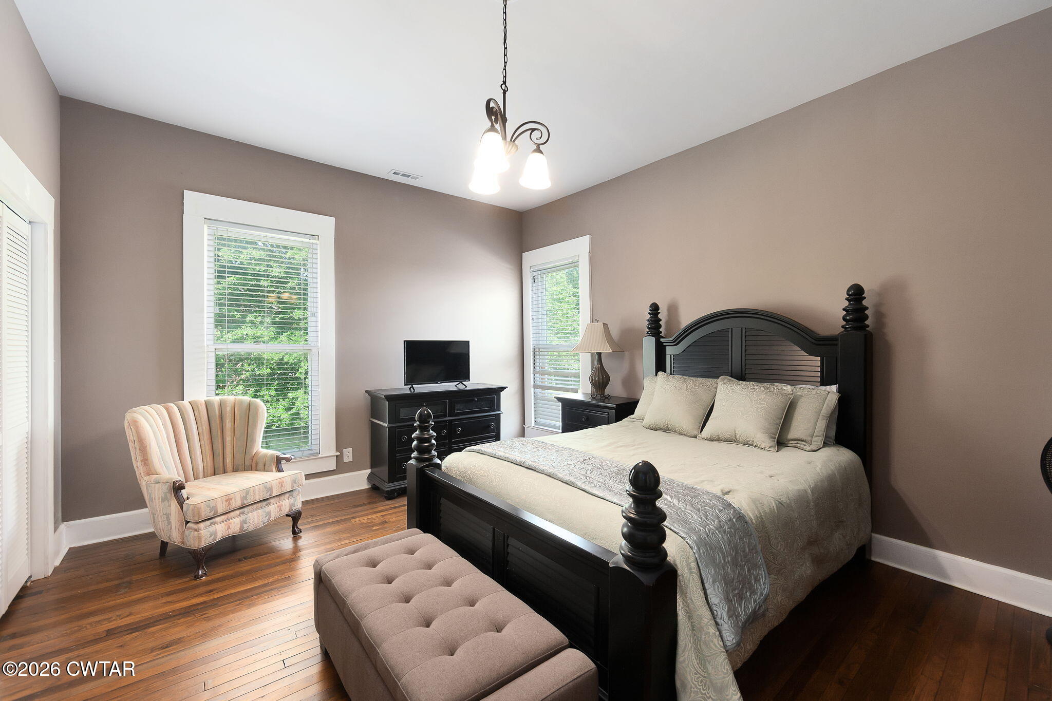 554 East Main Street Jackson, TN 38301 - Photo 35 of 60 a bedroom with bed chair and window