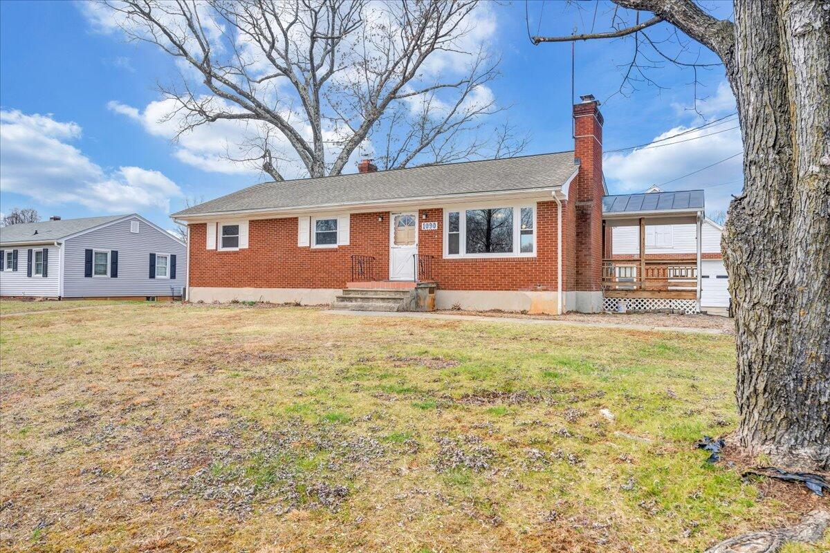 1090 Garner Road Vinton, VA 24179 - Photo 2 of 23 a front view of house with yard and trees around