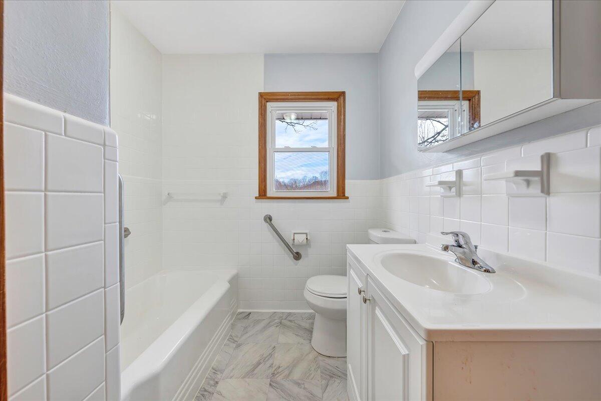 1090 Garner Road Vinton, VA 24179 - Photo 9 of 23 a bathroom with a sink and a mirror