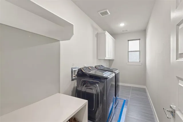 a view of a hallway with washer and dryer