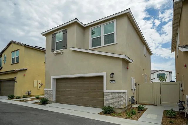 a front view of a house with a garage