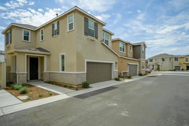 a front view of a house with a garage