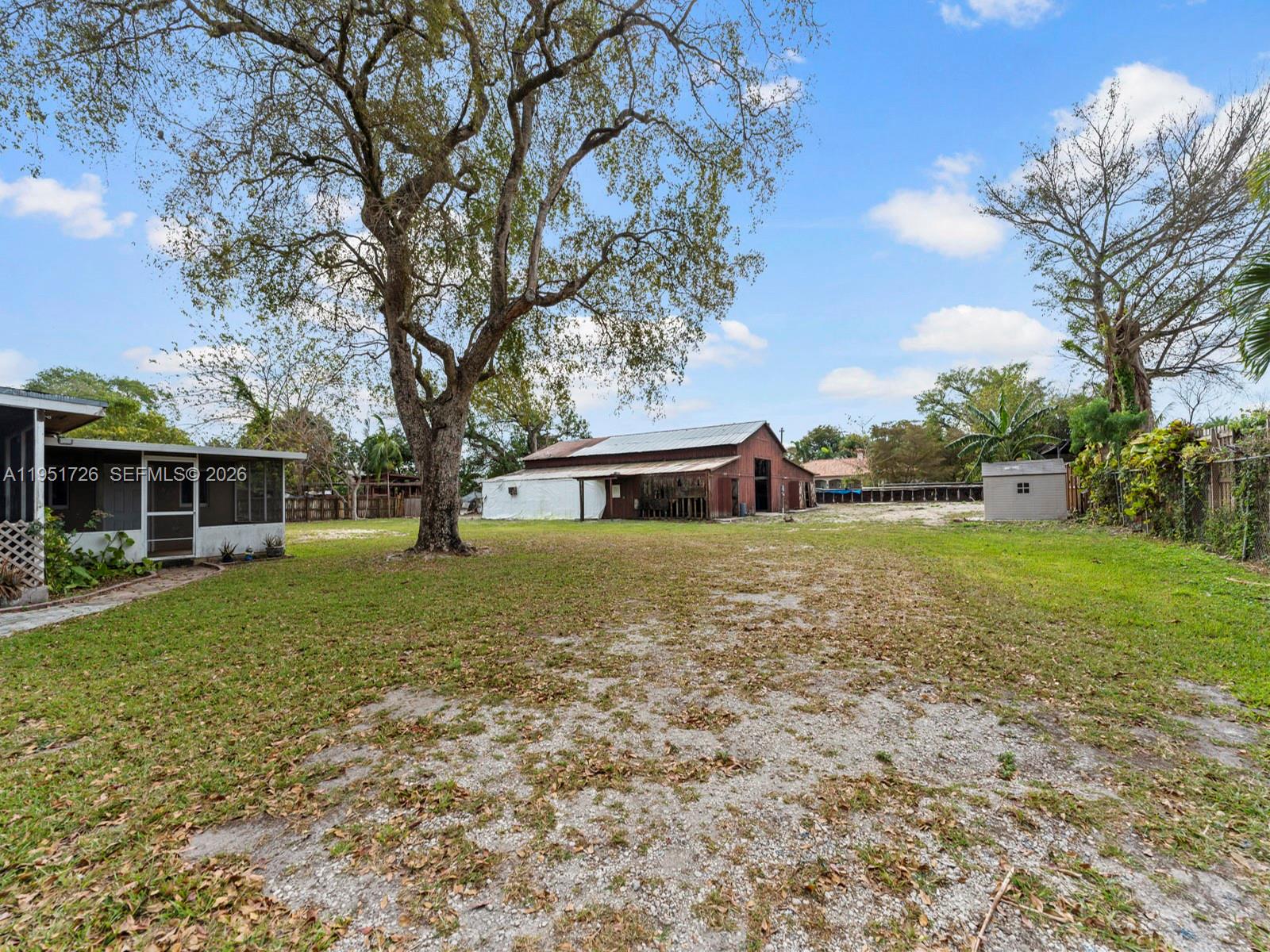 12570 Southwest 45th Street Miami, FL 33175 - Photo 14 of 25 a front view of a house with a yard