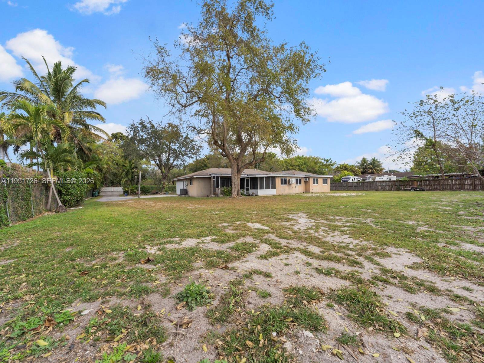 12570 Southwest 45th Street Miami, FL 33175 - Photo 15 of 25 a front view of a house with a garden