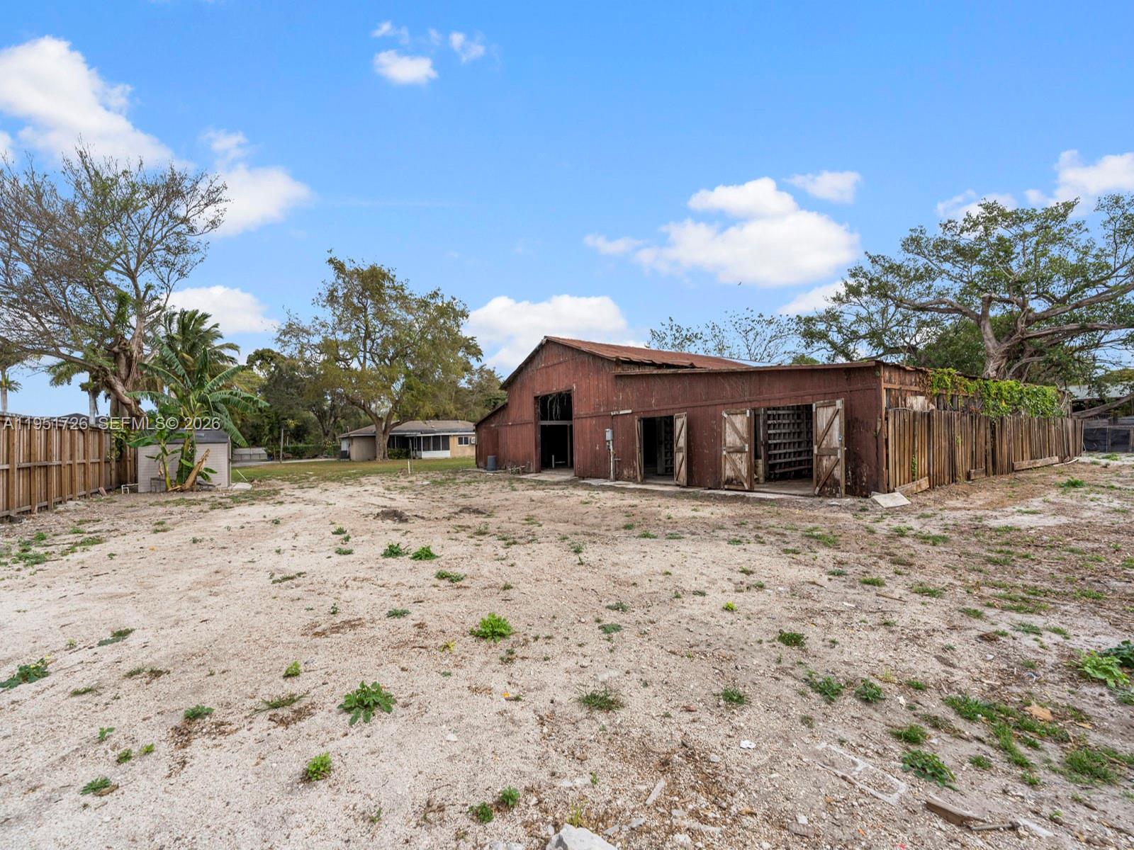 12570 Southwest 45th Street Miami, FL 33175 - Photo 18 of 25 a view of a house with a yard