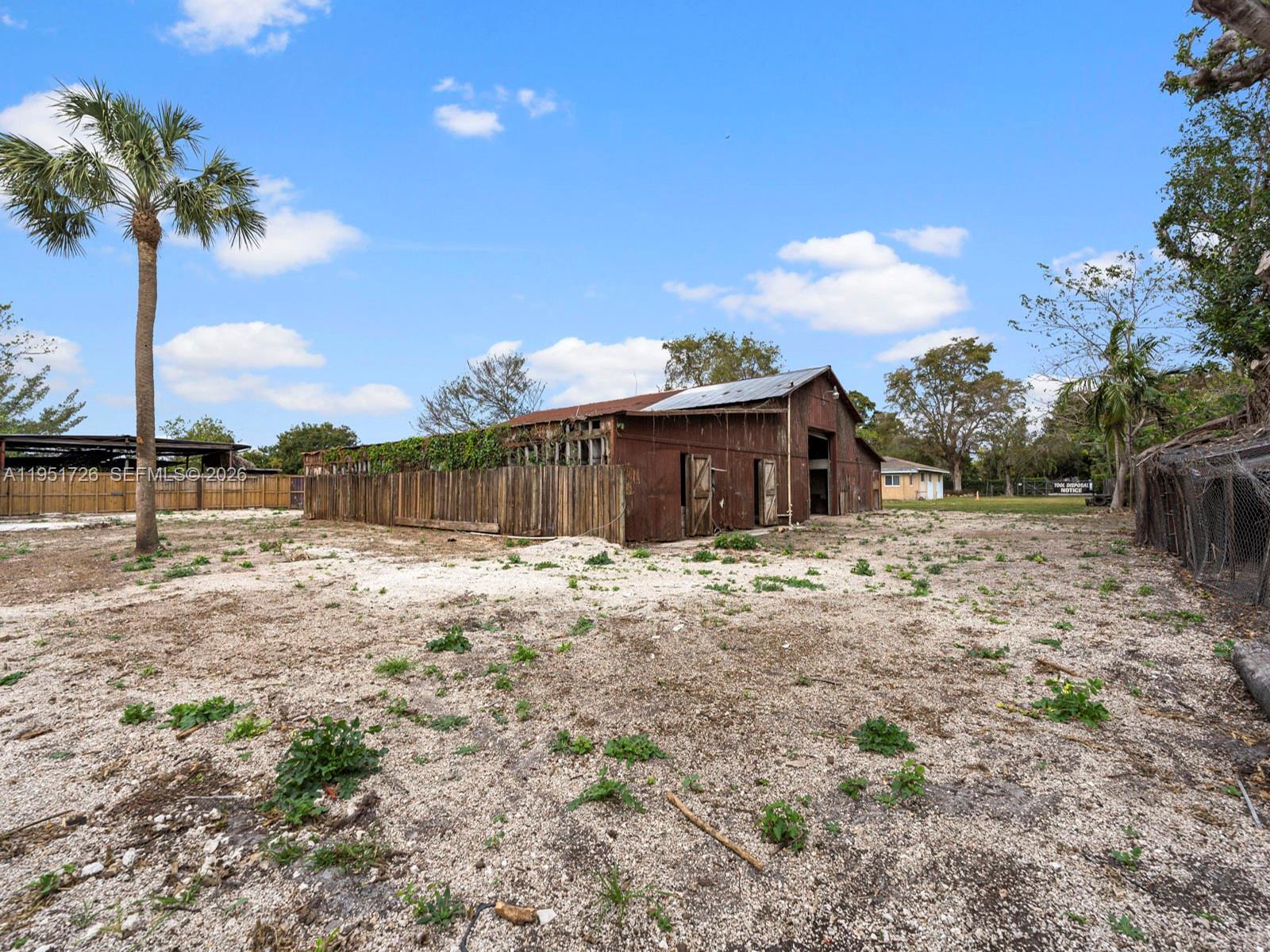 12570 Southwest 45th Street Miami, FL 33175 - Photo 19 of 25 a front view of a house with a yard