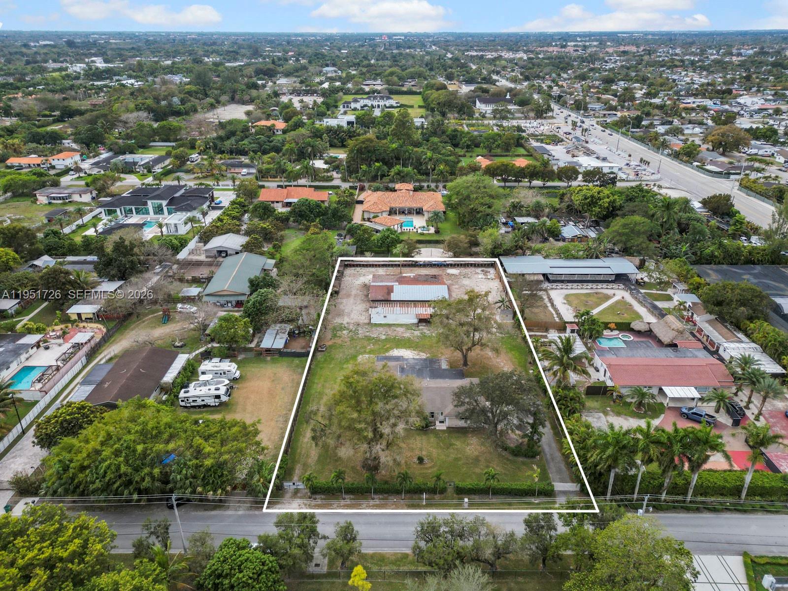 12570 Southwest 45th Street Miami, FL 33175 - Photo 2 of 25 an aerial view of residential houses with outdoor space