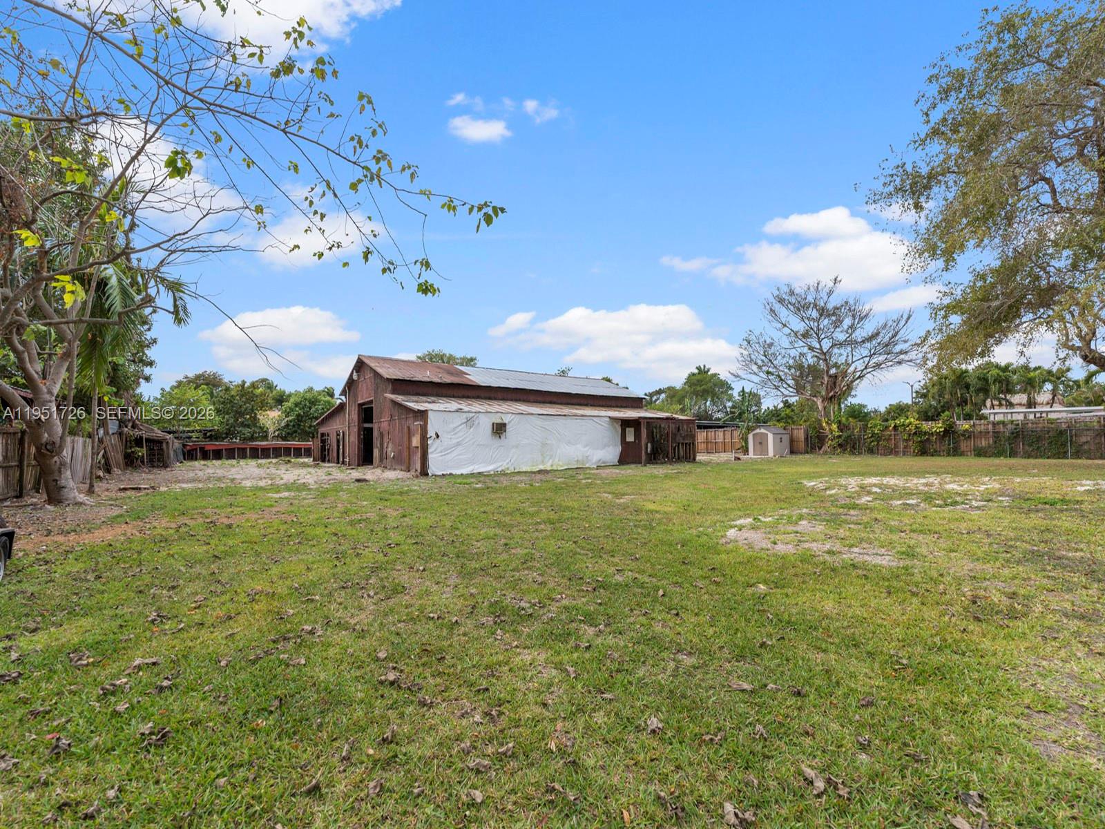 12570 Southwest 45th Street Miami, FL 33175 - Photo 22 of 25 a big room with lots of green space